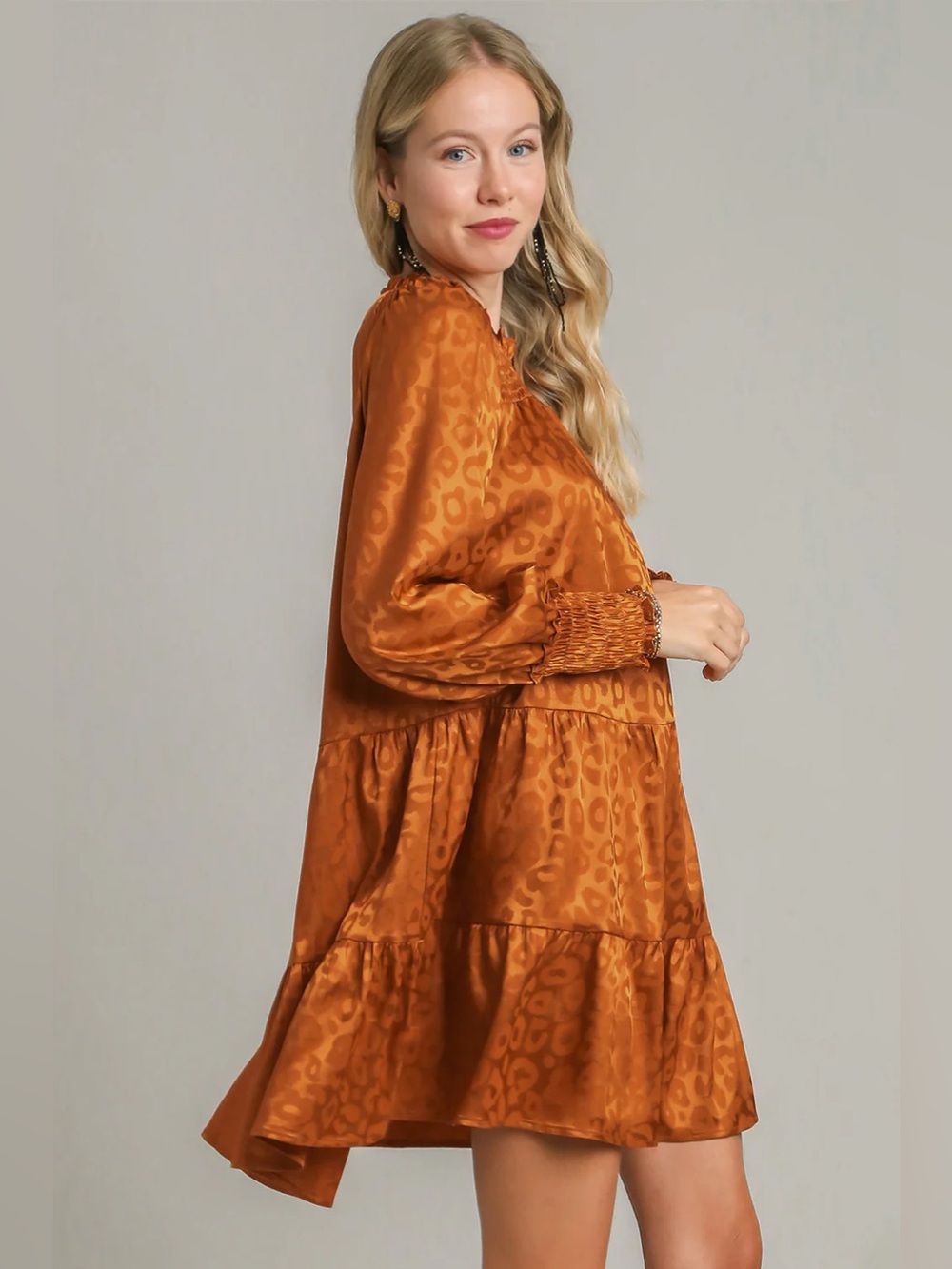 Leopard print long sleeve tiered ruffle mini dress. Orange brown animal print